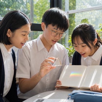 Students exploring a rainbow prism